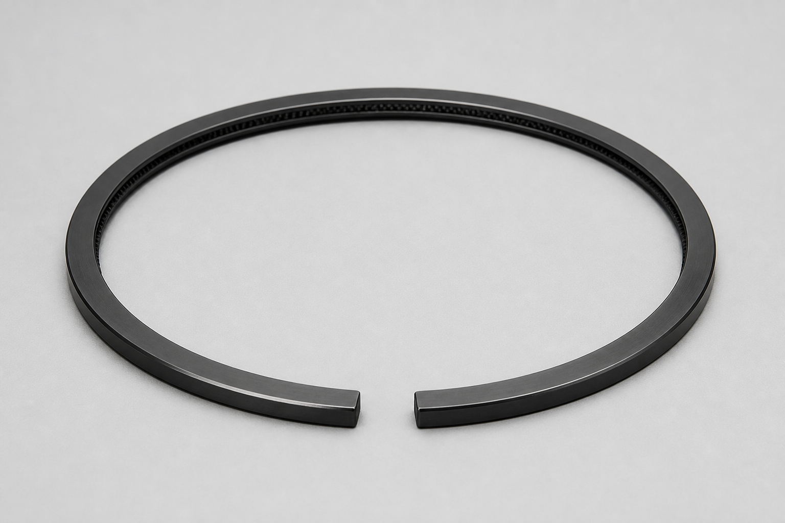 DLC-coated piston ring, graphite black with metallic sheen