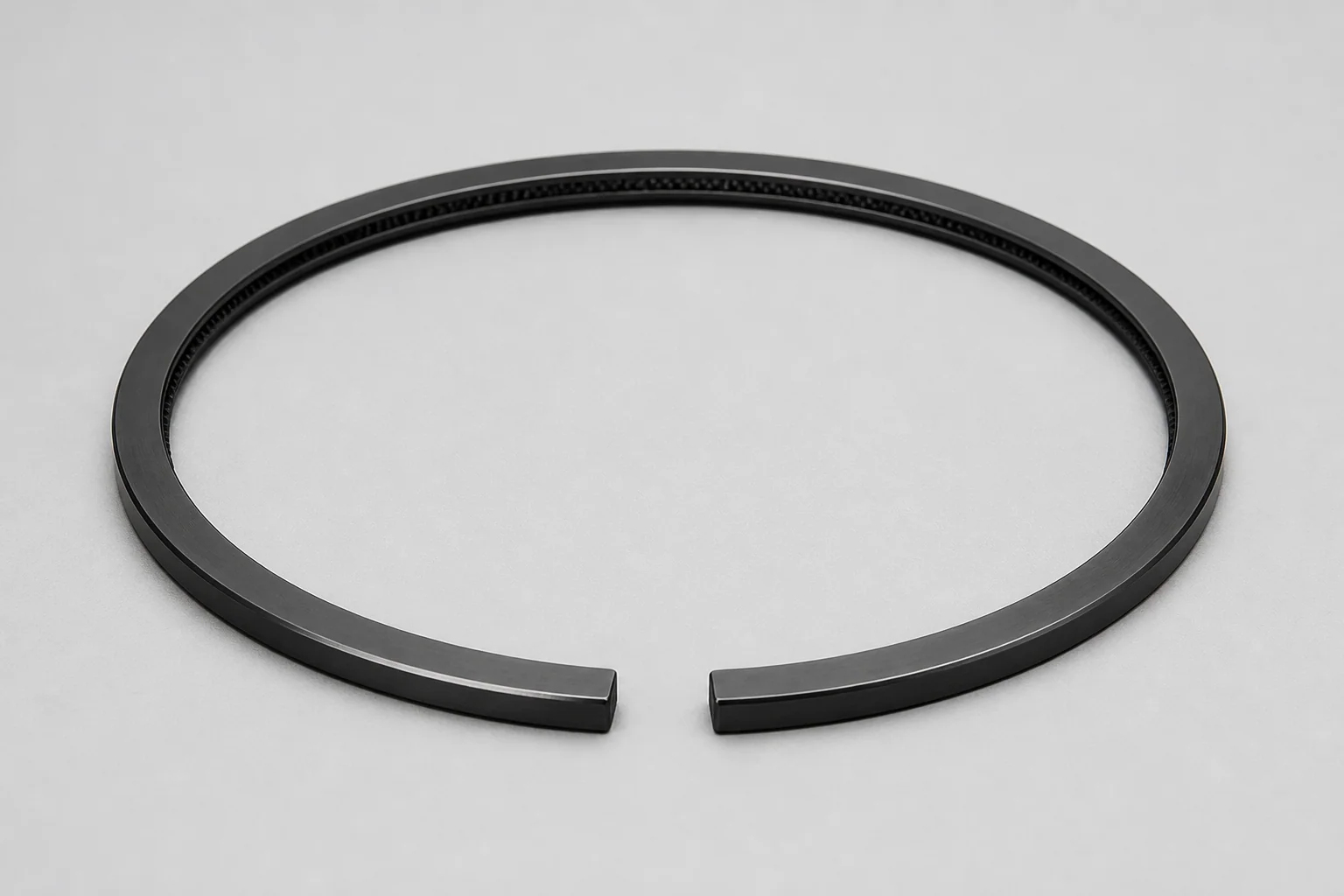 DLC-coated piston ring, graphite black with metallic sheen